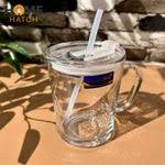transparent glass coffee mug with straw